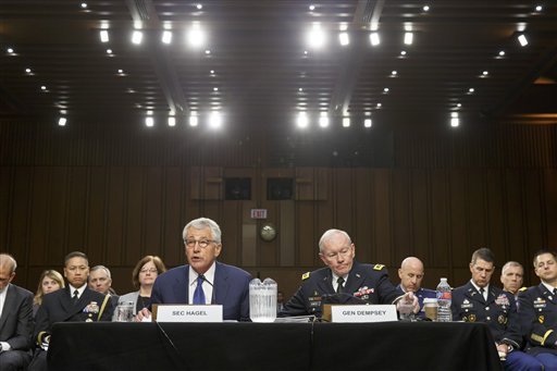 Defense Secretary Chuck Hagel, left, and Army Gen. Martin Dempsey, chairman of the Joint Chiefs of Staff, appear before the Senate Armed Services Committee, the first in a series of high-profile Capitol Hill hearings that will measure the president's ability to rally congressional support for President Barack Obama's strategy to combat Islamic State extremists in Iraq and Syria, in Washington, Tuesday, Sept. 16, 2014. Obama last week outlined his military plan to destroy the extremists, authorizing U.S. airstrikes inside Syria, stepping up attacks in Iraq and deploying additional American troops, with more than 1,000 now advising and assisting Iraqi security forces to counter the terrorism threat.