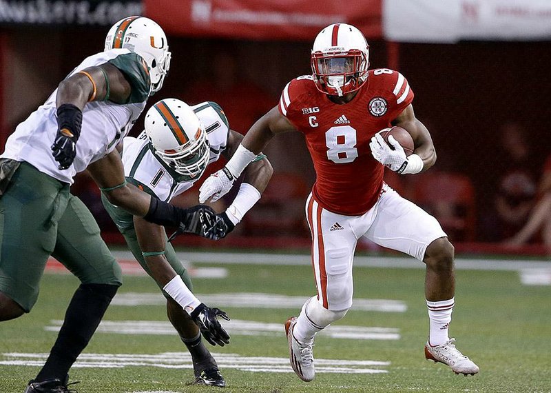 Nebraska running back Ameer Abdullah (8) ran for 229 yards and 2 touchdowns on 35 carries to lead the No. 24 Cornhuskers to a 41-31 victory over the Miami Hurricanes on Saturday at Memorial Stadium in Lincoln, Neb.