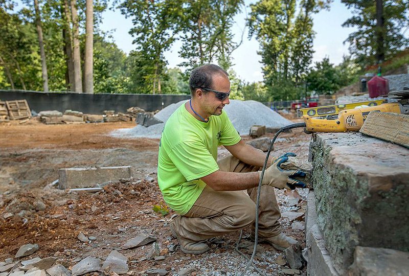 NWA Media/JASON IVESTER --09/17/2014--
Thomas Beshears with Fayetteville-based Hammer & Chisel works on the site for Frank Lloyd Wright's Bachman Wilson House on Wednesday, Sept. 17, 2014, on the grounds of Crystal Bridges Museum of American Art in Bentonville.