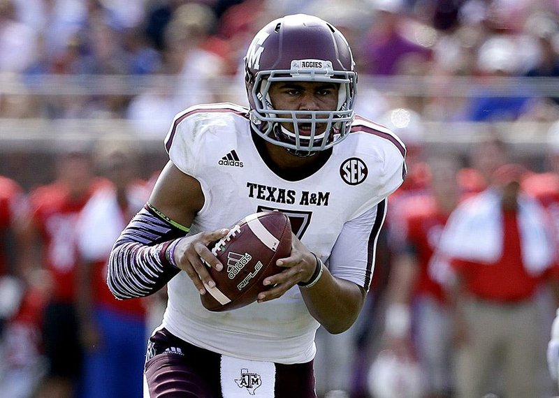 Texas A&M quarterback Kenny Hill (7) completed 16 of 22 passes for 265 yards with 2 touchdowns and his first career interception.