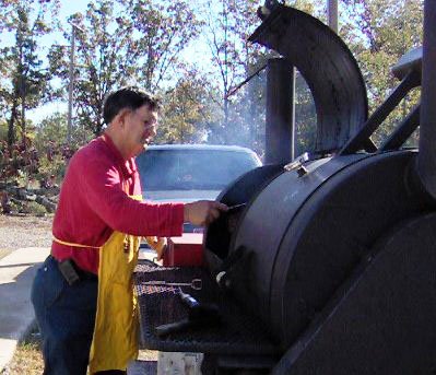 Submitted photo FINGER-LICKING GOOD: The annual Oaklawn Lions Club Chicken/Rib Feed will be held from 11 a.m. to 1 p.m. Friday with dinner from 4-7 p.m. Lion Bill Walker is shown grilling chicken at a previous event.