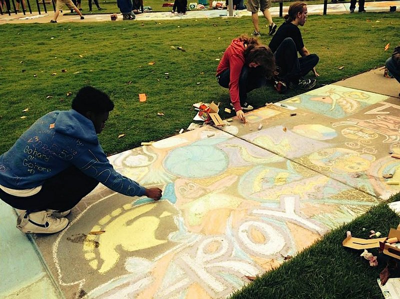 Submitted photo Paving the way: Students use chalk to decorate the sidewalks in front of the William J. Clinton Presidential Library as part of the recent "Thea Paves the Way" event in Little Rock. Hot Springs High School won a drawing for $250 of art supplies.