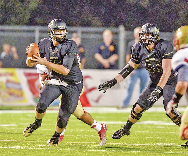 STAFF PHOTO BEN GOFF &#8226; @NWABenGoff Kasey Ford, Bentonville quarterback, looks for an open receiver Friday against Bergen Catholic (Oradell, N.J.) at Tiger Stadium in Bentonville.