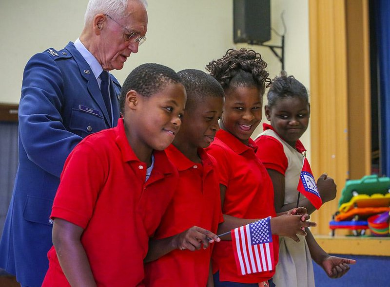 9/17/14
Arkansas Democrat-Gazette/STEPHEN B. THORNTON
Former LRAFB Colonel Jim Elmer, top left, helps guide a group of Boone Park Elementary School fifth graders as he teaches them how to march in an honor guard formation during his presentation on flag etiquette Wednesday in North LIttle Rock. Students from left are, Jaylin Drone, Daqurion Barrow, Kelis Davis, andDe'Shanti Lewis. 
FOR WEEKENDER: adgxflagprogramwknd