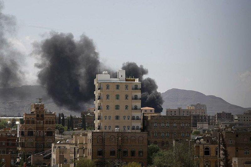 Smokes rises from an area due to clashes between Sunni militiamen and Hawthi Shiite rebels in Sanaa, Yemen, Sunday, Sept. 21, 2014. Yemen's top security body imposed an overnight curfew in restive areas of the capital, Sanaa, on Saturday after Shiite rebels took over the state television building amid heavy clashes and the U.N. envoy to the country signaled that a deal had been reached to end the violence. (AP Photo/Hani Mohammed)