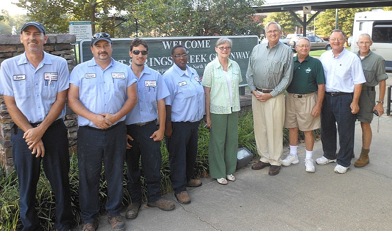 Submitted photo Charlie Bobus, left, Dewayne Smith, John Bright and Celita Phillips of City Plumbing, Heating &amp; Electric are pictured with Jean Wallace, Dr. John Simpson, Ted Carrithers, Ned Skoog and Ken Freeman of the Hot Springs Friends of the Parks at the Trailhead Sign in Transportation Plaza. Formed in 1994, Friends of the Parks currently has 65 active members. Their primary objective is to raise funds and advocate the numerous benefits of the Hot Springs Creek Greenway Trail. The organization was chosen by City Plumbing employees to receive their August donation. Call City Plumbing, Heating &amp; Electric at 623-3325 or 922-3325.