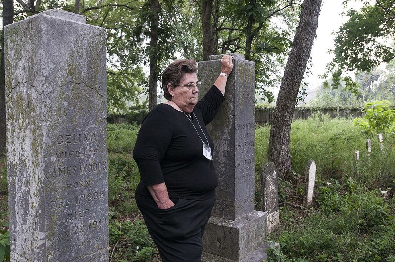 STAFF PHOTO ANTHONY REYES • @NWATONYR
Dorothy Miller, with the Benton County Cemetery Preservation Group, talks about the Woods Cemetery Tuesday, Sept. 16, 2014 in Little Flock. The cemetery dates back to the Civil War. 