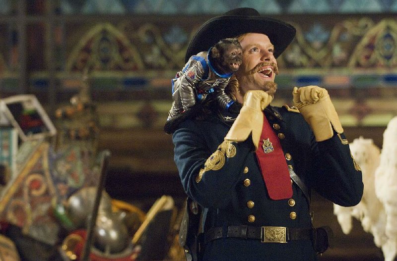 In this film publicity image released by Twentieth Century Fox, General Custer, portrayed by Bill Hader and Able the Space Monkey, portrayed by Crystal the  monkey, are shown in a scene from, "Night at the Museum: Battle of the Smithsonian." The film is among many animal-related films mentioned in the book "Animal Stars," a behind-the-scenes look at how trainers get everything from badgers to bears to safely do what dazzles. Set for release Sept. 25, the book is co-written by the head of the American Humane Association, whose entertainment unit is the industryís only sanctioned animal welfare program and is celebrating its 75th anniversary this year. (AP Photo/Twentieth Century Fox, Doane Gregory) 