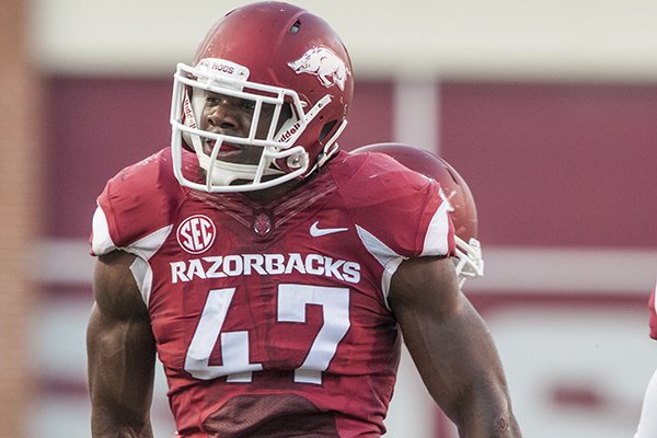 Arkansas linebacker Martrell Spaight (47) celebrates a defensive stop against Northern Illinois University in the first quarter Saturday, Sept. 20, 2014 at Razorback Stadium in Fayetteville.