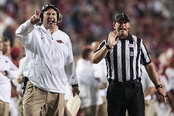 Arkansas head coach Bret Bielema calls out to his players against Northern Illinois University in the fourth quarter Saturday, Sept. 20, 2014 at Razorback Stadium in Fayetteville. The Razorbacks won 52-14.