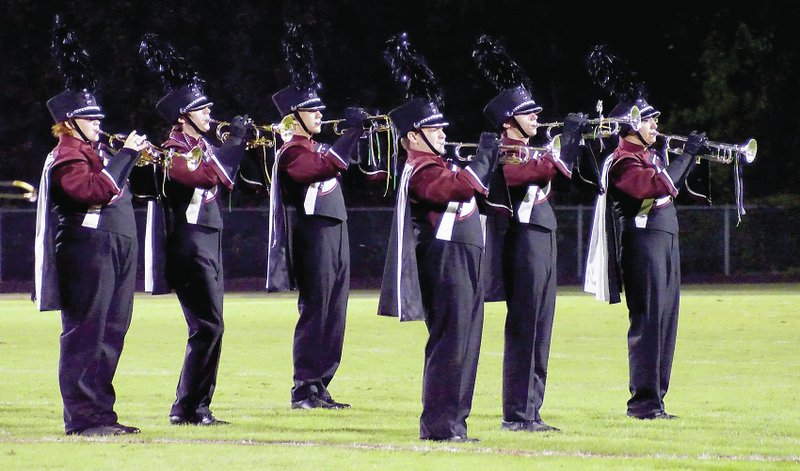 Photo by Randy Moll The cornet/trumpet section of the band played its parts during the halftime performance in Pioneer Stadium on Friday night.