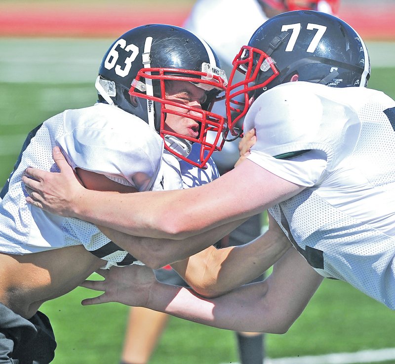  Staff Photo Michael Woods &#8226;@NWAMICHAELW Jonathan Small, Pea Ridge defensive end, goes through drills during practice Monday afternoon at Pea Ridge.