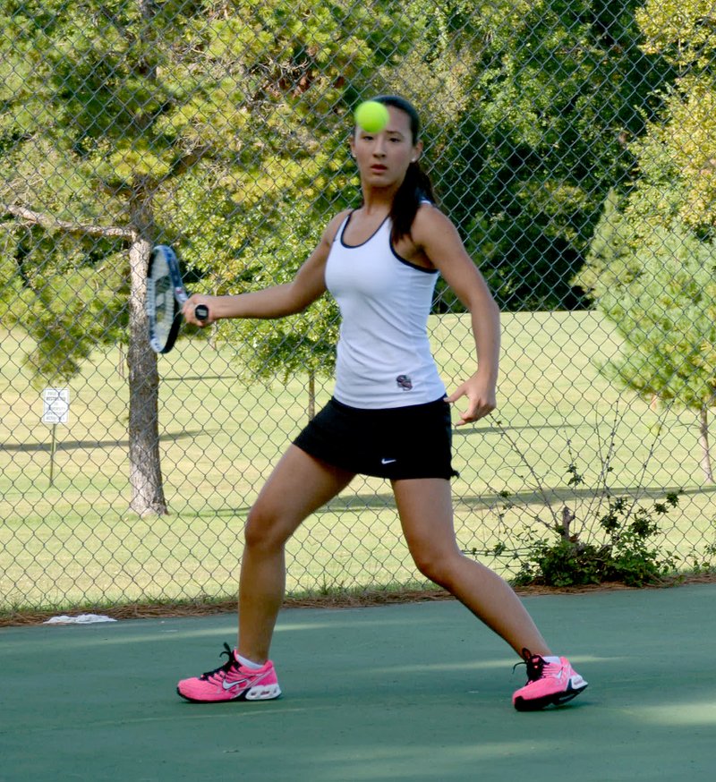 Graham Thomas/Herald-Leader Siloam Springs tennis player Jocelyn Backes returns a serve Monday during her singles match against Shiloh Christian.