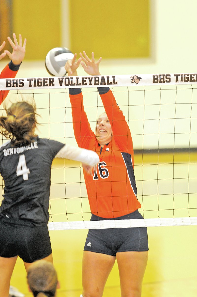  Staff Photo J.T. Wampler Sadie Pate of Bentonville gets the ball past Rogers Heritage&#8217;s Madison Hotelling on Tuesday in Bentonville.