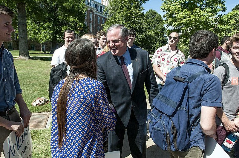U.S. Sen. Mark Pryor, D-Ark., meets with students after a press conference Wednesday at the University of Arkansas in Fayetteville. Pryor’s talk focused on his views on education.