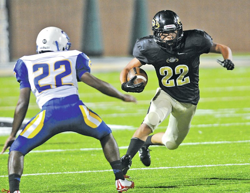 Bentonville Gold's Chris Walker looks to get around Central's Joey Escamilla Thursday Sept. 25, 2014.