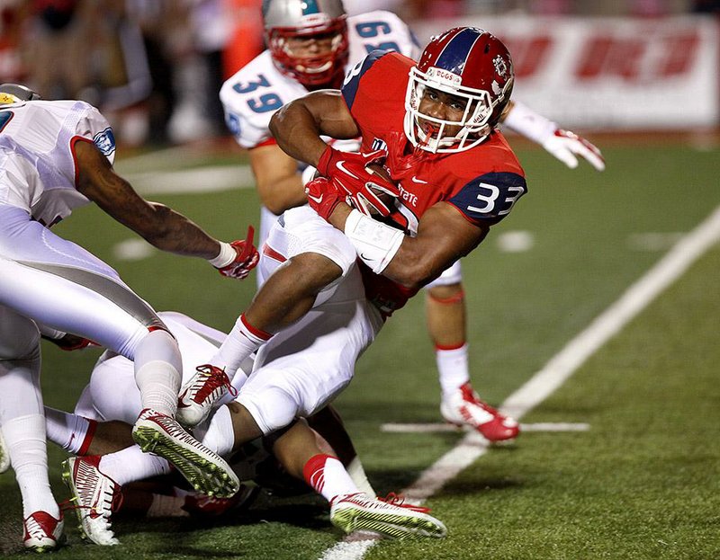 Fresno State running back Marteze Waller (33) had 19 carries for 163 yards in his team’s 35-24 victory over New Mexico.