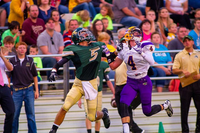 Little Rock Catholic’s Cole Moore defends on a pass to Alma’s Jake Folkerts on Friday night. Moore was flagged for pass interference on the play.