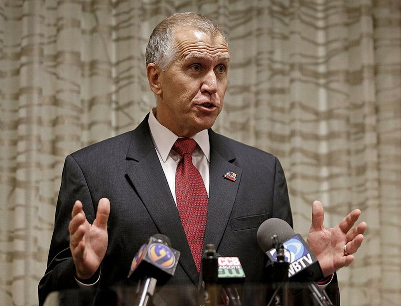 North Carolina Republican Senate candidate Thom Tillis answers a question from the media during a news conference in Greensboro, N.C., Friday, Sept. 26, 2014. (AP Photo/Chuck Burton)