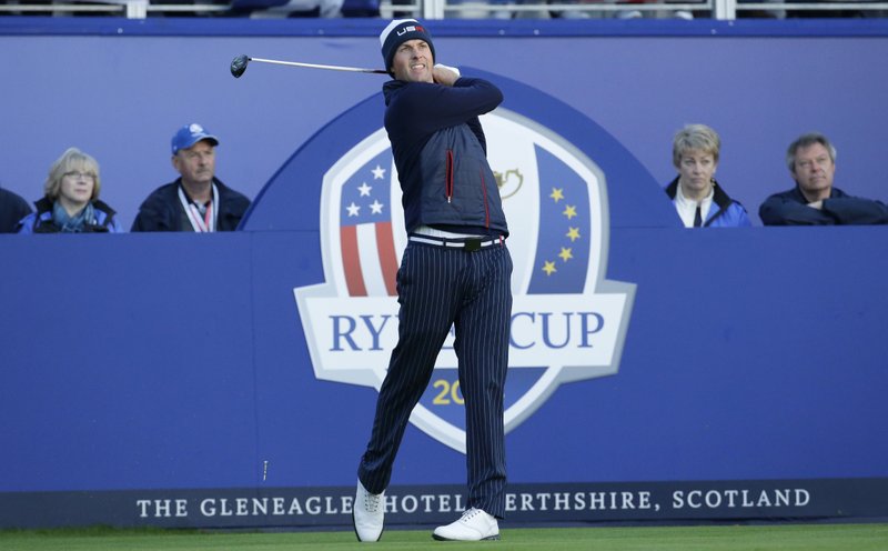 Webb Simpson of the US plays off the 1st tee during the fourball match on the first day of the Ryder Cup golf tournament, at Gleneagles, Scotland, Friday, Sept. 26, 2014.