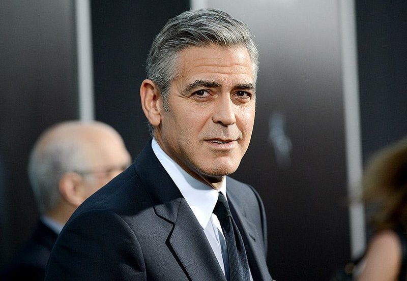 FILE - In this Oct. 1, 2013 file photo, actor George Clooney attends the premiere of "Gravity" at the AMC Lincoln Square Theaters, in New York. The Hollywood Foreign Press Association announced on the Golden Globe Awards website that Clooney will be the next recipient of the Cecil B. DeMille Award. The Golden Globe Awards will be held on Jan. 11, 2015. (Photo by Evan Agostini/Invision/AP, File)
