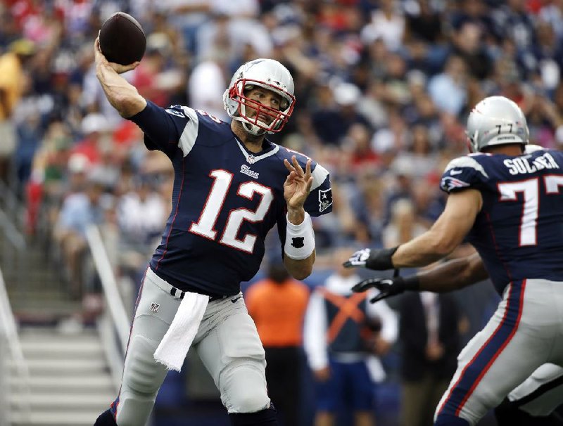FILE - In this Sept. 21, 2014, file photo, New England Patriots quarterback Tom Brady throws a pass against the Oakland Raiders during the first half of an NFL football game in Foxborough, Mass. (AP Photo/Steven Senne, File)