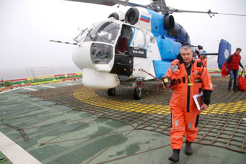 Igor Sechin, chief executive officer of OAO Rosneft, returns to the polar research vessel Akademik Tryoshnikov carrying a sample of oil from the West Alpha rig following the announcement of a new crude strike in the Kara Sea, Russia, on Saturday, Sept. 27, 2014. Sechin, a long-time ally of President Vladimir Putin, spent two days traveling by plane, ship and helicopter last week to announce a billion-barrel crude strike in the iceberg-prone Kara Sea region of Russiaís Arctic Ocean. Photographer: Ilya Arkhipov/Bloomberg *** Local Caption *** Igor Sechin EDITOR'S NOTE: BEST QUALITY AVAILABLE