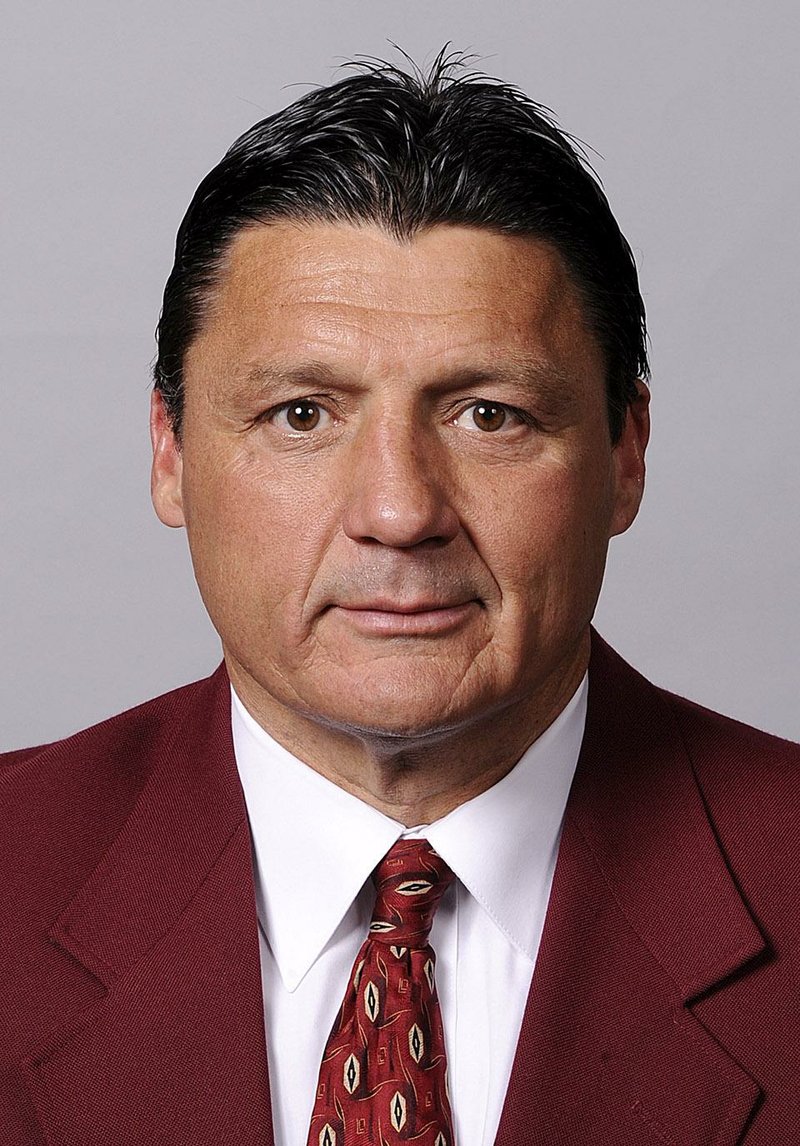 In a photo provided by the University of Southern California, date not known, Ed Orgeron poses for a photo. USC fired Lane Kiffin as football coach early Sunday morning, Sept. 29, 2013, ending the coach's tumultuous tenure a few hours after the Trojans lost 62-41 at Arizona State. Orgeron was picked as USC's interim head coach by athletic director Pat Haden, (AP Photo/University of Southern California)