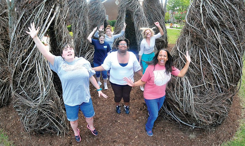 Students from the University of Central Arkansas Department of Occupational Therapy will assist consumers from Independent Living Services as they participate in a dance with the CORE Performance Co. at 5:30 p.m. Friday at UCA. The performance, which is part of Conway ArtsFest, will be presented on the McCastlain Hall lawn, in and around an outdoor sculpture created by Patrick Dougherty. Getting ready for the performance are, foreground, from left, Michelle Cook and Iyana McDaniel, both of Conway and ILS consumers, and Melodie Mauney of Searcy, UCA occupational-therapy student; and background, Amy Ward of Conway, ILS consumer, and Meredith Wallis of Waco, Texas, and Sarah Ligon of Heber Springs, both UCA occupational-therapy students.