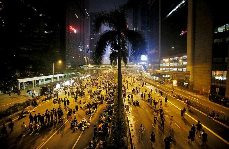 Student protesters occupy a main thoroughfare in Hong Kong late Tuesday. Hong Kong’s leader refused to meet with pro-democracy demonstrators by their midnight deadline Tuesday despite their threats to expand the protests that have clogged the streets with tens of thousands of people in the stiffest challenge to Beijing’s authority since China took control of the former British colony in 1997.