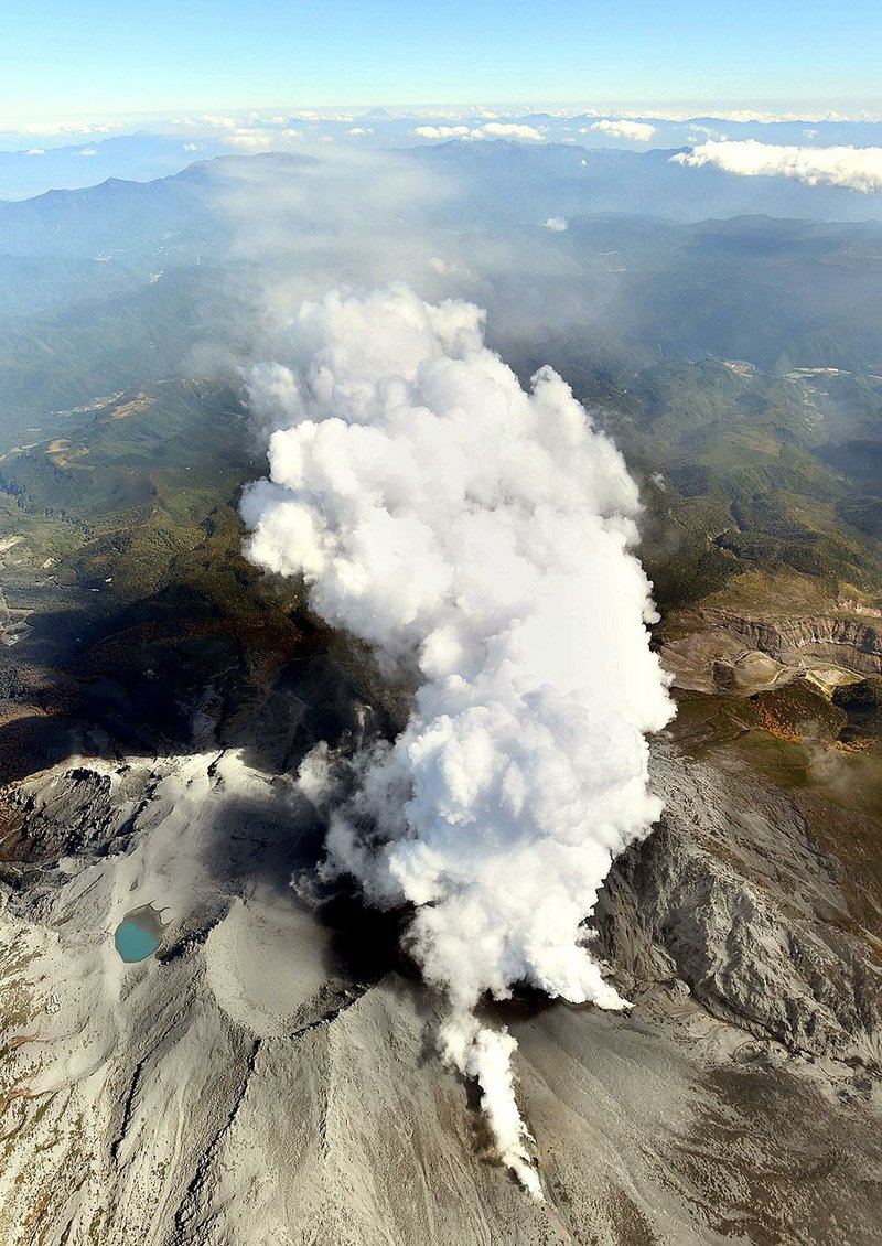 Gases and ash billow from the crater of Mount Ontake on Tuesday afternoon.