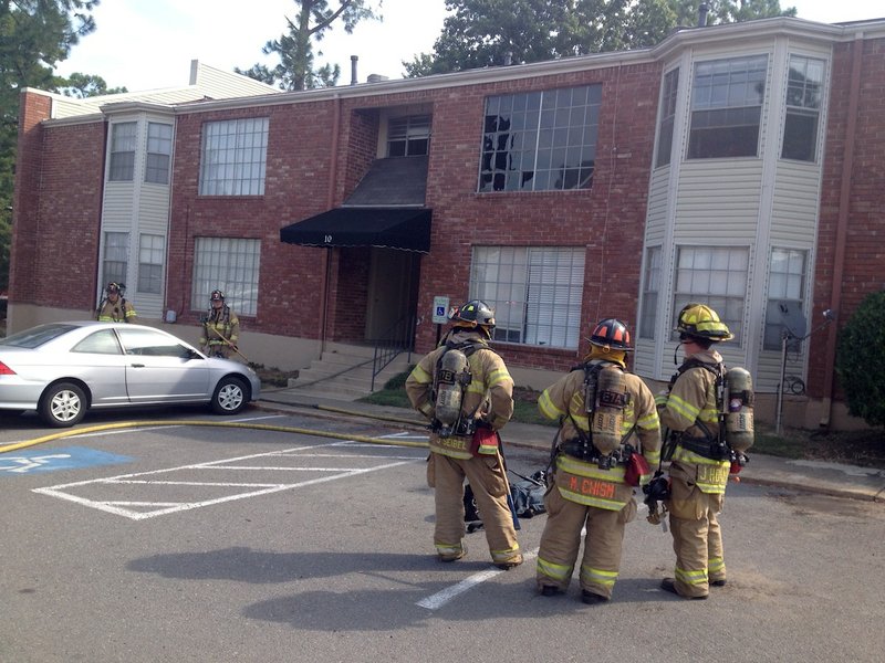 Little Rock firefighters investigate a small fire Tuesday morning at Watergate Apartments, 8101 Cantrell Road.