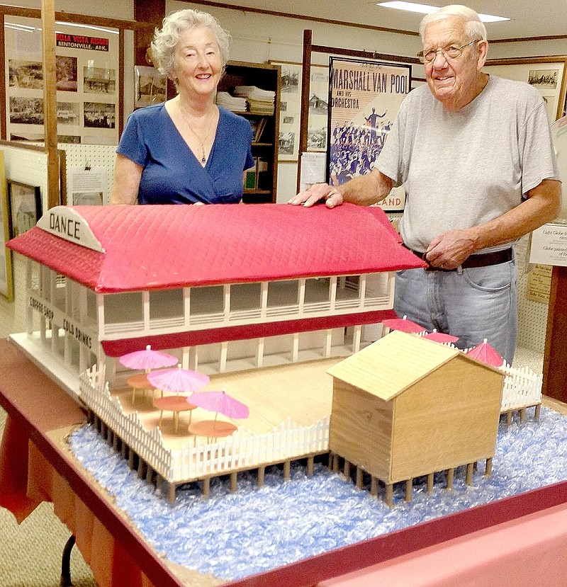 Courtesy of Xyta Lucas Former Bella Vista resident Gene Heezen delivers to Carole Harter, director of the Bella Vista Historical Museum, the Dance Pavilion model he recently built.