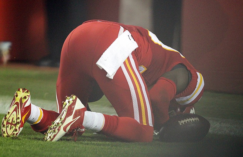 The Associated Press GIVING THANKS: Kansas City free safety Husain Abdullah prays after an interception return for a touchdown in the fourth quarter of the Chiefs' 41-14 victory over the New England Patriots Monday night. The NFL said Tuesday that Abdullah should not have been penalized for unsportsmanlike conduct when he dropped to his knees in prayer after the play.