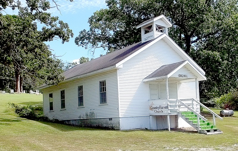 Lynn Atkins/The Weekly Vista The Dug Hill Community Building, built in 1936, overlooks U.S. 71 at Town Center. It&#8217;s now in use again by a brand new church group on Sunday mornings.