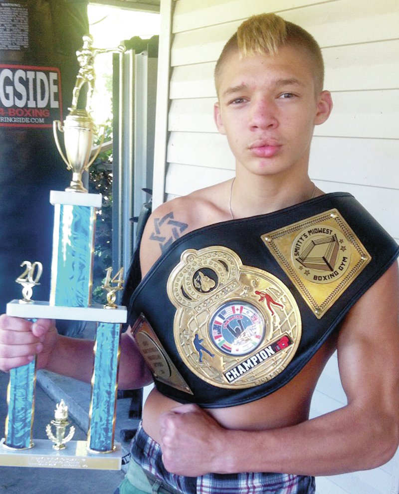 Kapner wins boxing awards Noah Kapner, of Gravette, won a belt and an Outstanding Fighter of the Night trophy at the Ready to Rumble fight in Springfield Mo. on Sept. 20. He is currently ranked Number 4 at 138 pounds in the official U.S. ranking for amateur boxers. Submitted Photo