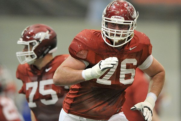 Arkansas offensive tackle Dan Skipper goes through practice Thursday, April 3, 2014 at the Walker Indoor Pavilion in Fayetteville. 