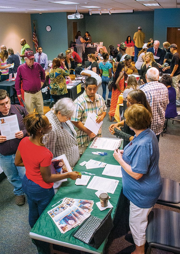 The room was packed for the start of the job fair at the Garland County Library.