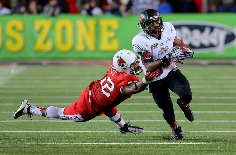 Arkansas State running back Michael Gordon, trying to escape a tackle in the 2014 GoDaddy Bowl in January, said he still feels pain from his bruised ribs when he gets hit, but that pain is nothing like what he felt when he was first injured against Montana State on Aug. 30.