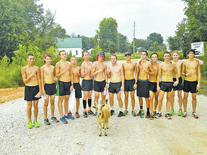 SUBMITTED PHOTO MIKE POWER A goat that resides in the Phillips Cemetery Road area returned to run with Bentonville&#8217;s boys cross country team last month. The goat appeared several times two years ago when the Tigers first started using the area for training runs, but didn&#8217;t appear last year.