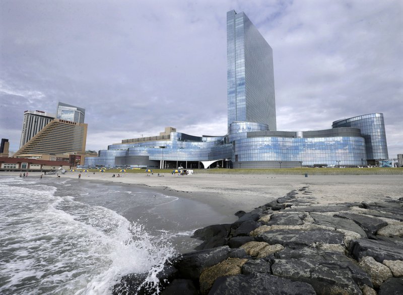 In this Monday, Sept. 1, 2014 file photograph, the closing Revel Casino Hotel, right, is seen next to the already closed Showboat Casino Hotel in Atlantic City, N.J. When the $2.4 billion Revel Casino Hotel on the Atlantic City Boardwalk, closed, it was the most spectacular and costly failure in Atlantic City's 36-year history of casino gambling. On Tuesday, Sept. 30, 2014, a bankruptcy court auction for Revel is scheduled to resume. An auction that began a week earlier was suspended due to the Rosh Hashanah holiday.