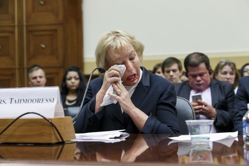 Jill Tahmooressi, mother of Marine Sgt. Andrew Tahmooressi of Weston, Fla., who has been held for six months in a Mexican jail, weeps after reading his letters from confinement and as others recount his heroism in Afghanistan, during a House Foreign Affairs subcommittee hearing on Capitol Hill in Washington, Wednesday, Oct. 1, 2014. Sgt. Tahmooressi, who suffers from post traumatic stress syndrome, claims he made an accidental wrong turn March 31 into a border-crossing point in Tijuana when he was arrested because he had guns in his vehicle.