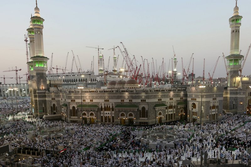 Muslim pilgrims pray outside the Grand Mosque, a day before Muslim's annual pilgrimage, known as the Hajj, in the Muslim holy city of Mecca, Saudi Arabia, Wednesday, Oct. 1, 2014.