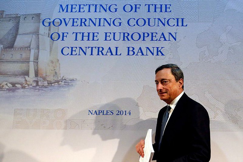 Mario Draghi, president of the European Central Bank (ECB), arrives for a news conference to announce the bank's interest rate decision in Naples, Italy, on Thursday, Oct. 2, 2014. The Frankfurt-based central bank will start buying covered bonds this month and asset-backed securities by the end of the year, Draghi said today at a press conference in Naples, Italy, after leaving interest rates unchanged at record lows. Photographer: Alessia Pierdomenico/Bloomberg *** Local Caption *** Mario Draghi