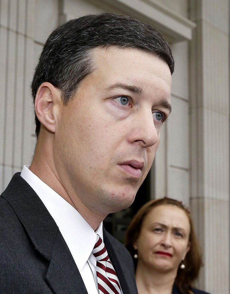 Attorney Jeff Priebe, left, is interviewed at the Arkansas Supreme Court in Little Rock, Ark., as Rita Sklar, executive director of American Civil Liberties Union of Arkansas listens Thursday, Oct. 2, 2014. Justices heard oral arguments Thursday in the challenge to the voter ID law enacted last year by the Arkansas Legislature. (AP Photo/Danny Johnston)