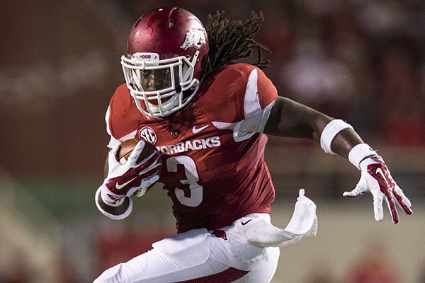 Arkansas running back Alex Collins runs toward the end zone during a game against Northern Illinois on Saturday, Sept. 20, 2014 at Razorback Stadium in Fayetteville. 
