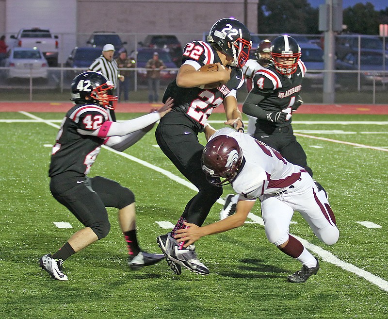 Photograph courtesy of Russ Wilson Sophomore Blackhawk Britton Caudill returned a blocked punt for a touchdown Friday night in a home game against the Lincoln Wolves.