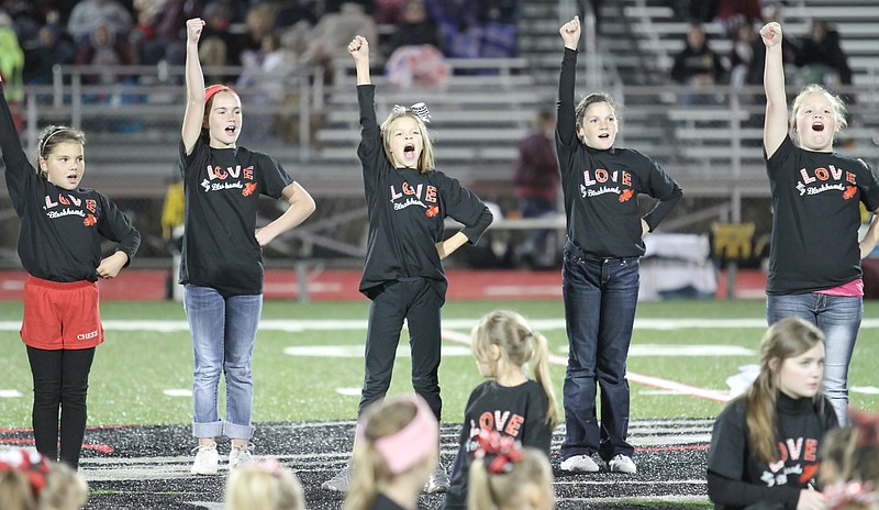 Photograph courtesy Russ Wilson Pee Wee cheerleaders performed Friday night before the contest with Lincoln during a pre-game show by cheerleaders and the band.