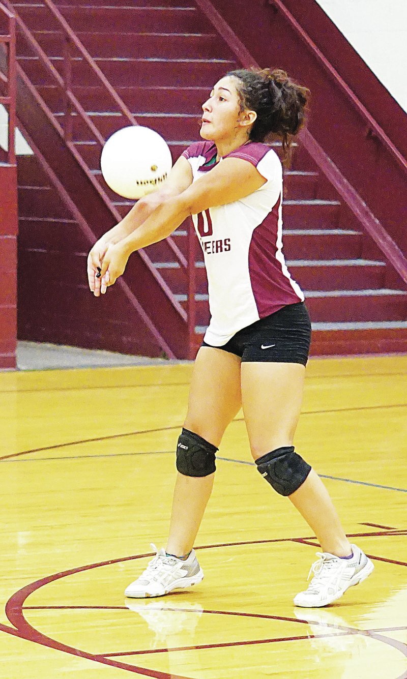 Photo by Randy Moll Gentry senior Vianca Serna receives a serve and sets up the ball during recent play in Gentry. The Pioneers fell to Berryville on Sept. 30. Thursday&#8217;s game was cancelled due to weather threats. Gentry coach Greg Johnson said, &#8220;We have been struggling through some injuries this whole season. We are improving because our highs are higher but our lows are still too low. We are working on some more advanced plays and I hope we will be reaching our peak here at the end of the season. Right now our goal is to steal a win in districts. Gravette played Prairie Grove on Sept. 30 and lost 0-3 &#8212; 25-8, 25-10 and 25-17.