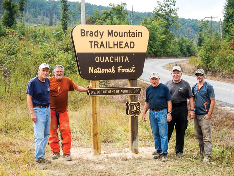 Submitted photo STILL AT WORK: Last week, members of the Trail Dogs volunteers installed a sign at Brady Mountain trailhead. Members include, from left, Al Gathright, Dan Watson, Jerry Shields, John Nichols and Jeremy Cudzewicz. Not pictured is Robert Cavanaugh.